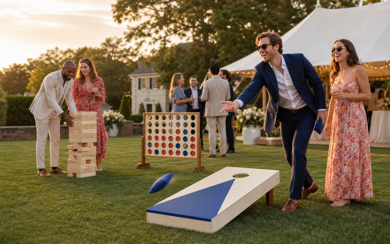 Wedding guests playing cornhole, a giant tumbling tower and four-in-a-row on an estate lawn